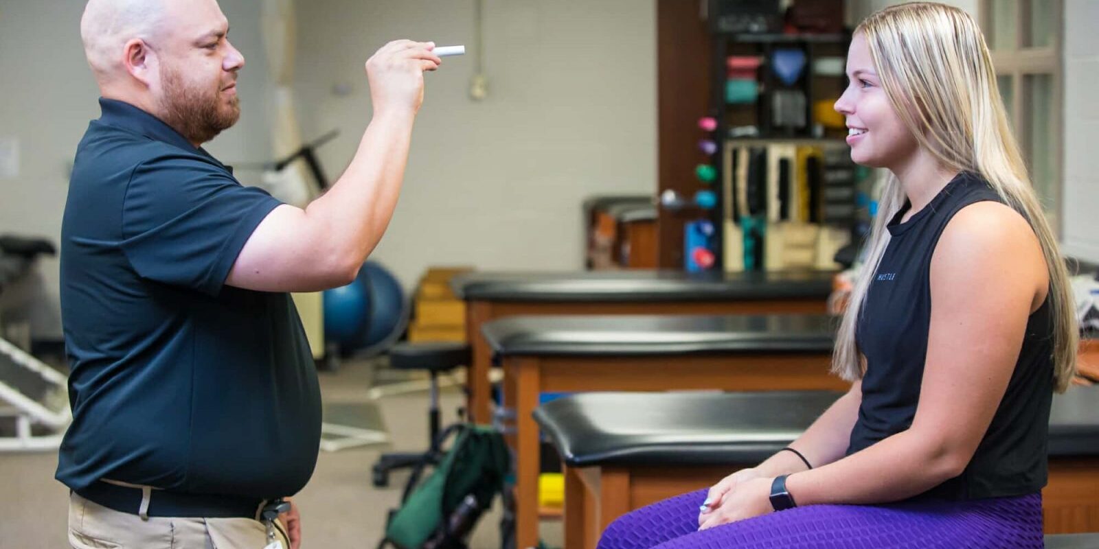 Athletic Trainer Examines Eye Coordination