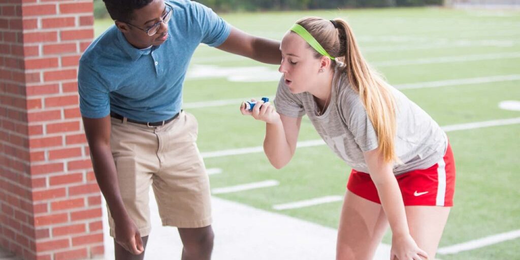 Athletic Trainer Works With Athlete With Asthma