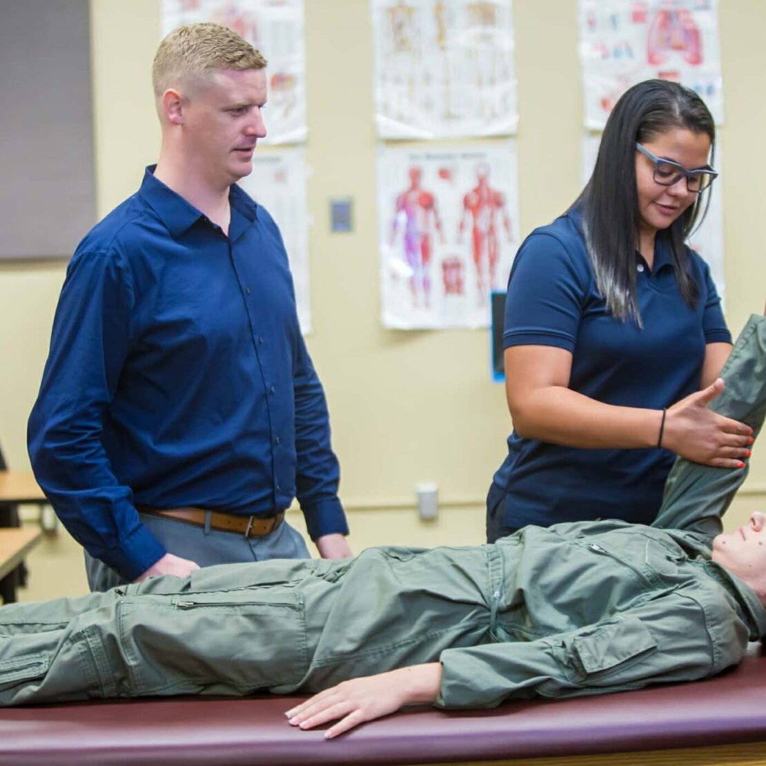 Trainers Working With Military Patient